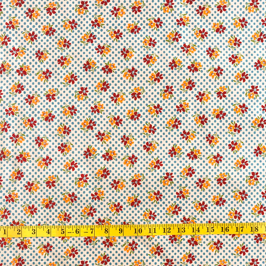 Small orange flower - blue spot*